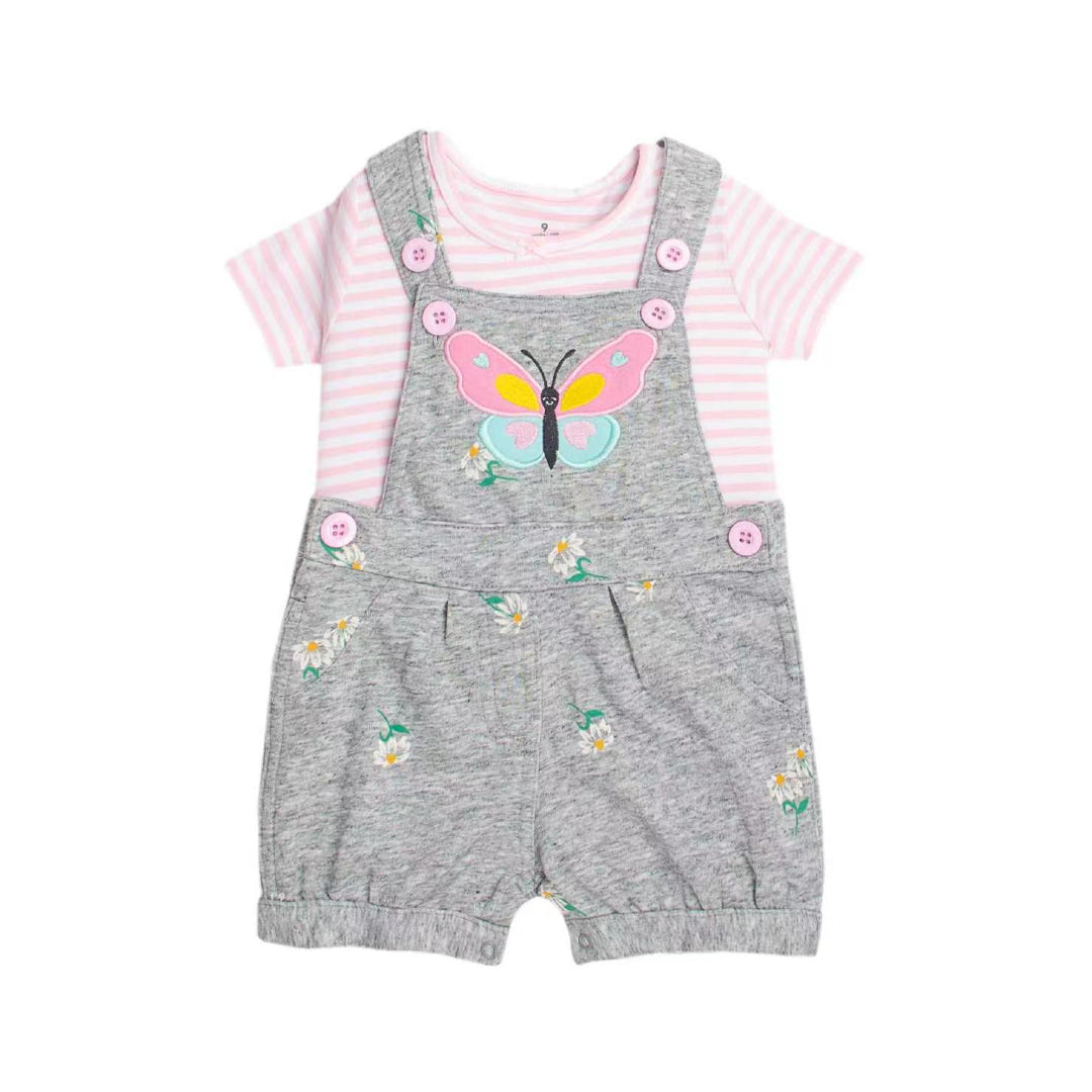 A baby girl's two-piece outfit featuring gray heathered overall shorts with a pink and yellow butterfly applique and small white daisy prints, paired with a pink and white striped short-sleeve t-shirt.