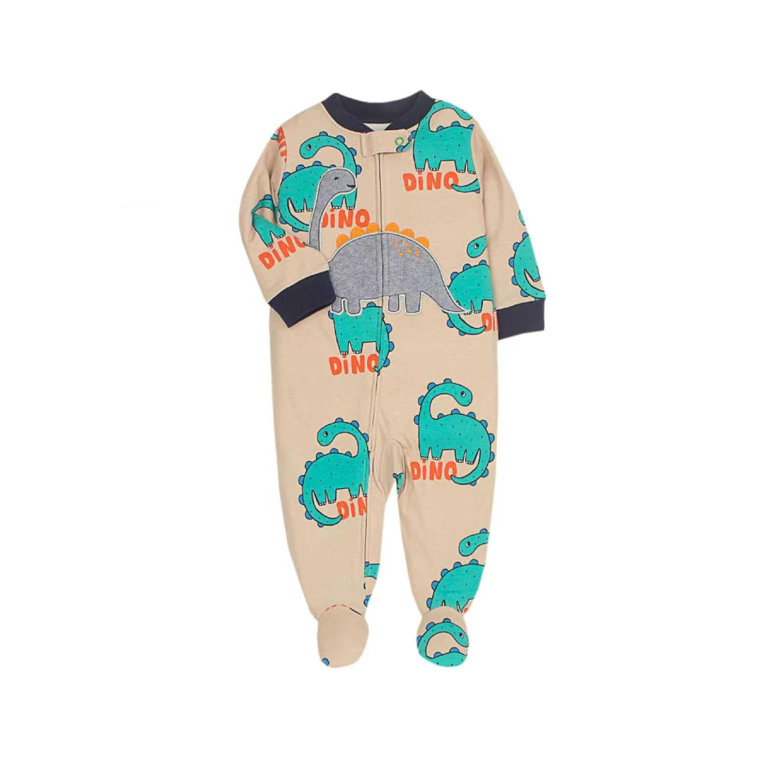 Baby wearing the Dinosaur Footed Sleeper – Sand Multi from Lullaby Threads in a dinosaur-themed nursery, showcasing soft baby sleepwear with a playful dinosaur design.