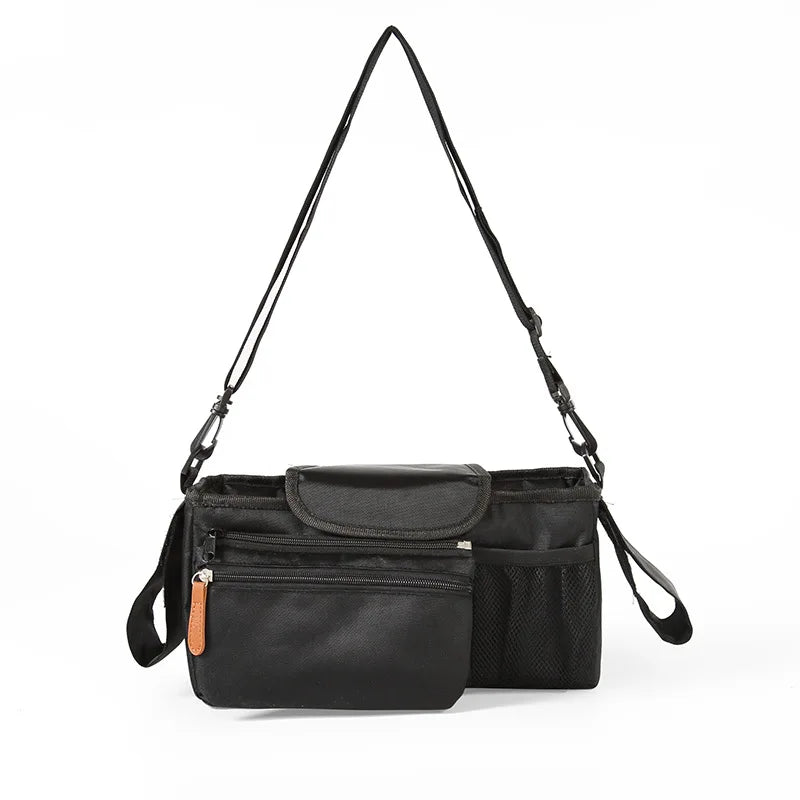Black crossbody bag with a strap on a white background