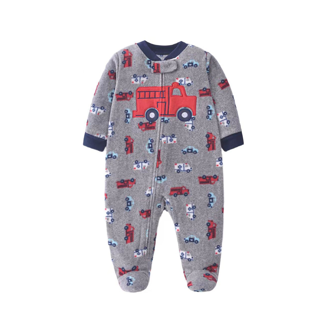 A baby's long-sleeve footed sleeper in heather gray, featuring a red fire truck and small red, blue, and white vehicle patterns, with navy blue ribbed cuffs and collar.