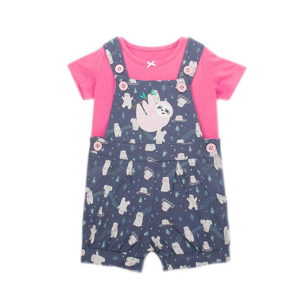 A baby girl's short-sleeve romper set featuring navy blue overalls with a white cartoon bunny print, layered over a bright pink short-sleeve t-shirt. The set is displayed flat against a solid white background.