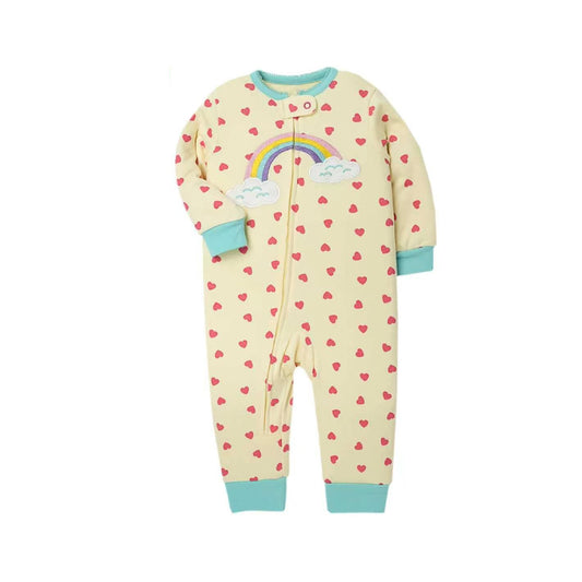 A baby long-sleeve footless sleeper in pale yellow, decorated with a repeating pattern of small red hearts, a rainbow, and white clouds on the chest, finished with light blue cuffs and hem.Rainbow Dreams Baby Romper – Sunshine Yellow