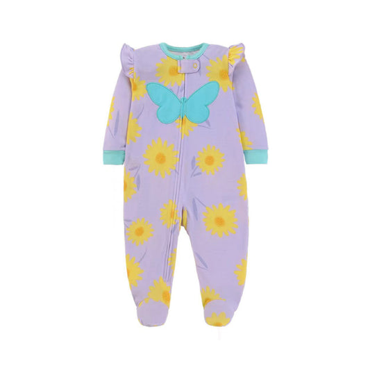 A baby footed sleeper in lavender purple with a yellow sunflower print, a light blue butterfly applique on the chest, and light blue trim on the cuffs and collar.