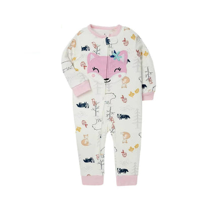 A baby's long-sleeve zip-up footless pajama romper in an off-white color, decorated with a whimsical forest print featuring a large pink fox face on the chest, trees, squirrels, birds, and mushrooms. The cuffs and collar are solid pink.