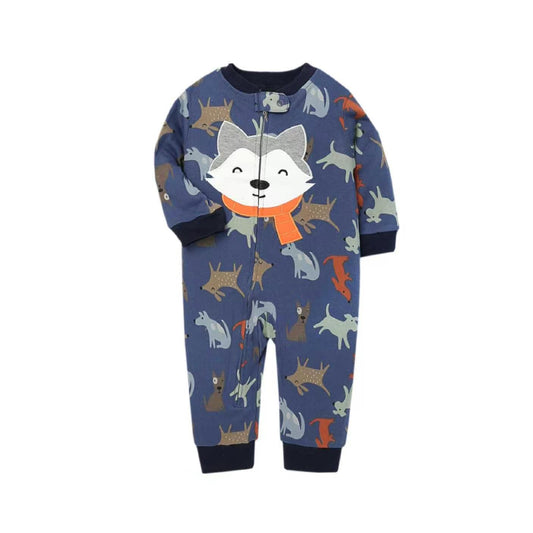 A baby's long-sleeve footless one-piece pajama or jumpsuit in navy blue, featuring an all-over print of cartoon foxes in various colors and a large fox face wearing an orange scarf on the chest. The garment has dark navy ribbed cuffs and hem, and a front zipper.